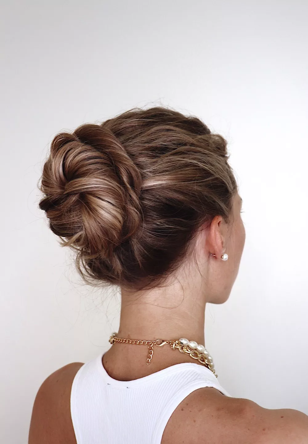 Twist and tuck updo quick wedding guest hairstyle